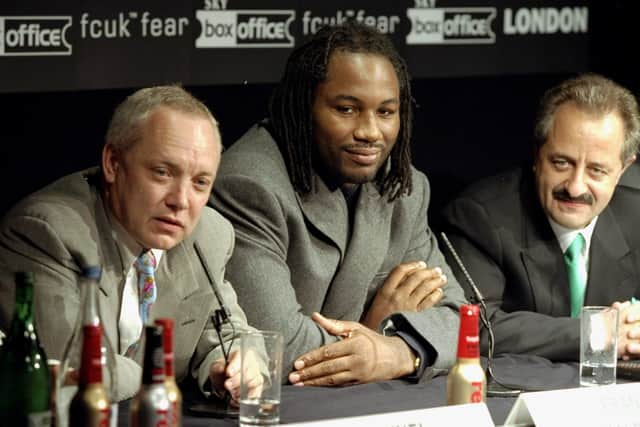 TOP PROMOTER:  Lennox Lewis flanked by his manager Frank Maloney back in November 1999.
