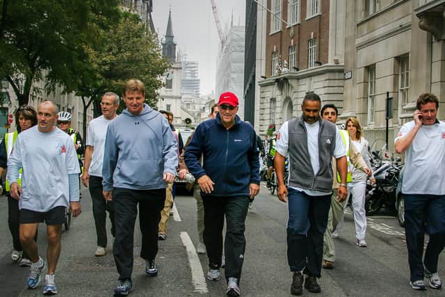 SIr Ian on one of his charity Beefy walks with celebrities including boxer Barry McGuigan Picture: David Betteridge,
