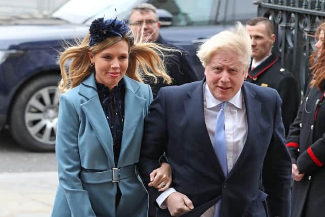 Boris Johnson and his partner Carrie Symonds earlier this year before the birth of their son.
