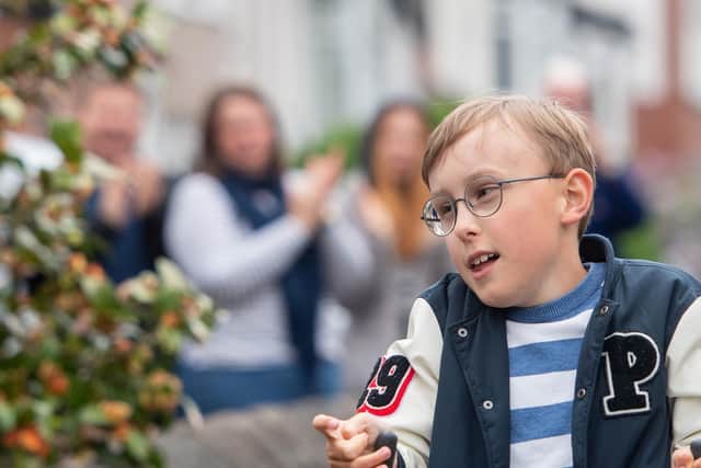 Nine-year-old Tobias, who cannot stand or walk unaided, has been inspired by Captain Tom Moore and is aiming to complete a marathon on his daily walks. Photo credit: Joe Giddens / PA Wire