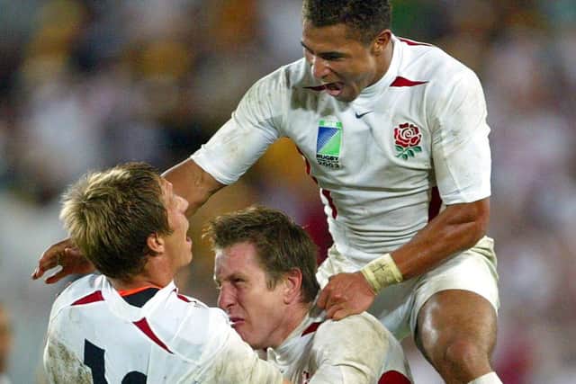 ON TOP OF THE WORLD: England's Jason Robinson, right, Will Greenwood, centrr, and Jonny Wilikinson celebrate after winning the final of the Rugby World Cup in Sydney, in November 2003.