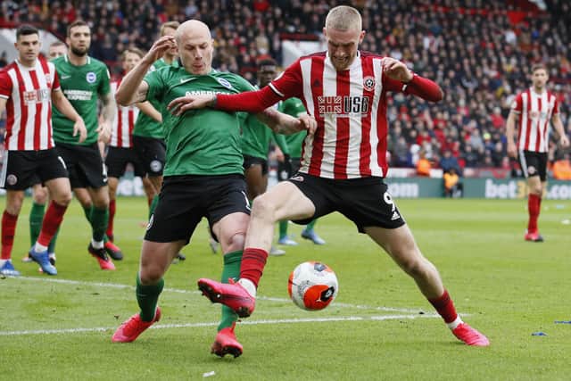 Aaron Mooy of Brighton tussles with Oli McBurnie of Sheffield Utd.  Picture: Simon Bellis/Sportimage