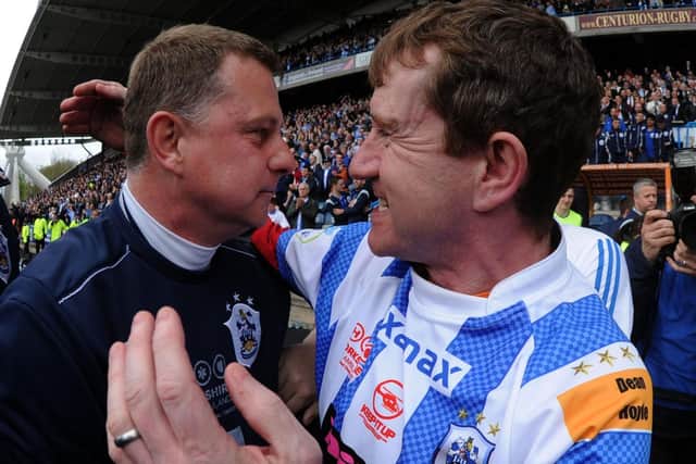 Phew:
Huddersfield Town manager Mark Robins and owner Dean Hoyle celebrate after the final whistle. Picture: Mark Bickerdike