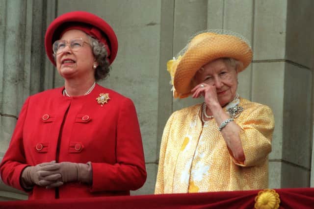 The Queen Mother wipes her eye on the balcony of Buckingham Palace on the 50th anniversary of VE Day. Picture: PA