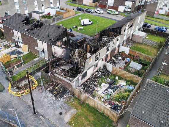 Dramatic images show the devastating impact and destruction after fire ravaged through a terrace of prefab houses.