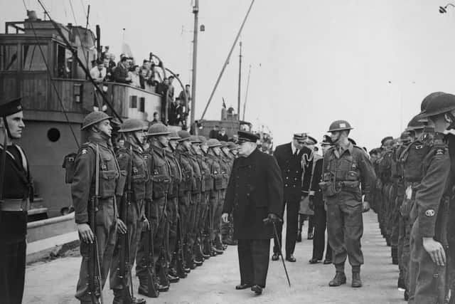 Winston Churchill inspects the troops during World War II, December 1942. (Photo by Fox Photos/Hulton Archive/Getty Images)