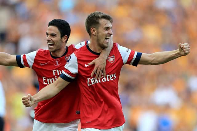 Tigers tamed: Arsenal's Aaron Ramsey, right, celebrates with team-mate Mikel Arteta after victory over Hull City.