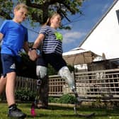 Maisie Catt pictured  with her brother Finlay after completing her 26 mile Marathon walk, at her home at Mirfield..Picture by Simon Hulme