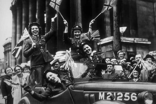 Typical street scenes on May 8, 1945, as VE Day was celebrated.