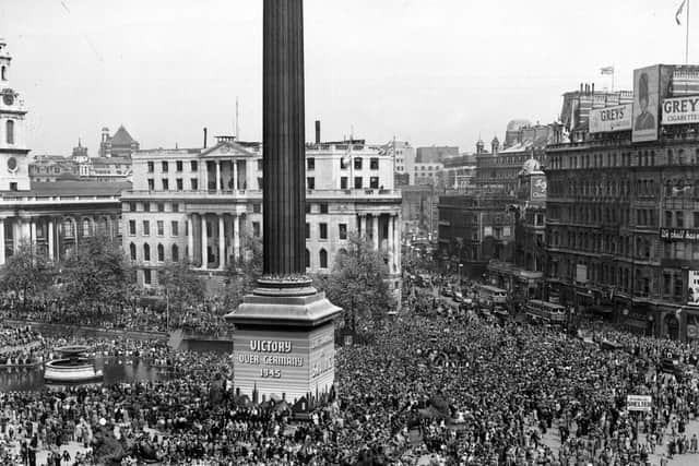 Crowds gather at Trafalgar Square on VE Day.  (Credit: Getty Images).