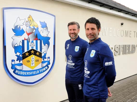 REVAMP: Assistant manager Nicky Cowley (left) and manager Danny (right) are reviewing for Huddersfield Town operate with the help of Mark Devlin