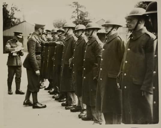 Men of the West Yorkshire Regiment being inspected in their tin helmets at Aldershot (Photo by Hulton Archive/Getty Images)
