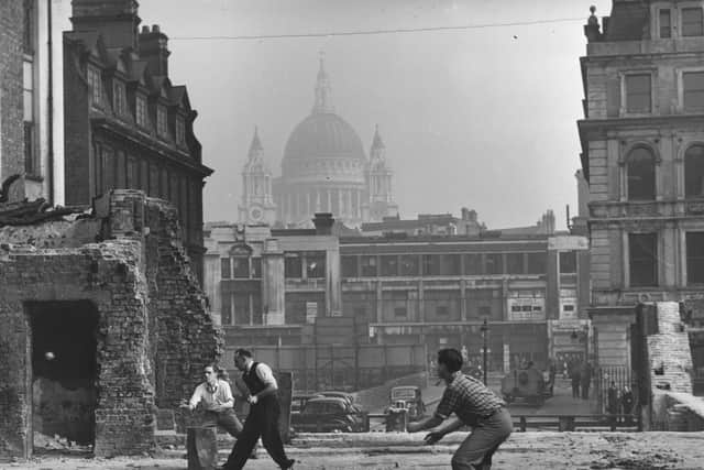 A group of men playing cricket on a blitzed site in October 1945. Photo by Harry Todd/Fox Photos/Getty Images
