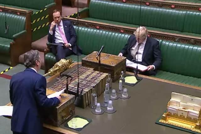 Boris Johnson and Matt Hancock look on as Sir Keir Starmer questions the PM in the House of Commons for the first time.