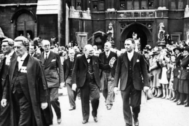 Winston Churchill leaves the Houses of Parliament after events to mark VE Day.