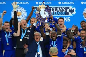Champions: Leicester City captain Wes Morgan and manager Claudio Ranieri lift the trophy.