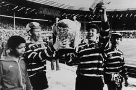 Featherstone Rovers' Peter Smith, Steve Quinn and Ken Kellett show the fans the Challenge Cup.