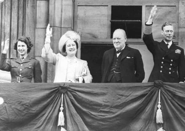 A young Princess Elizabeth (left) with her parents and Winston Churchill on the balcony of Buckingham Palace on VE Day.