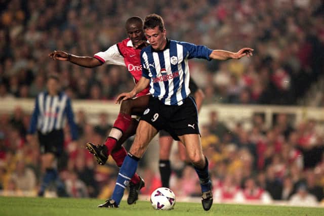 Relegation: Gerald Sibon holds off Patrick Vieira as a 3-3 draw at Highbury confirmed relegation for Sheffield Wednesday. Picture: Jamie McDonald /Allsport
