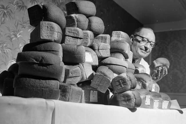 25th November 1965:  Ted Page judging a bread baking competition.  (Photo by Express/Express/Getty Images)