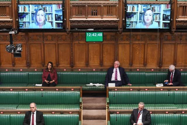 MPs are mostly sitting virtually in the House of Commons, with some still attending in person. Photo: PA