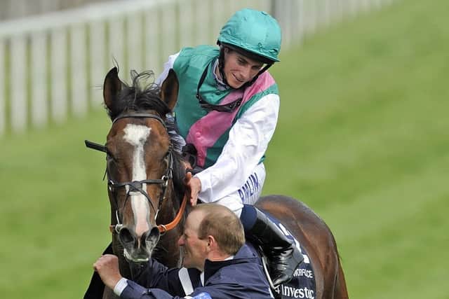 Ryan Moore celebrates the 2010 Derby win of Workforce for Prince Khalid Abdullah.