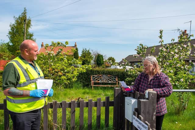 Kevin Mort, who is doing door to door welfare checks for North Yorkshire County Council checking on people with no digital resources in the Malton area during the pandemic, giving them a help leaflet and on Saturdays a copy of The Yorkshire Post. Pic: Bruce Rollinson