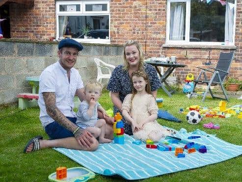 Craig and Faye Myers with Emme and young Arthur celebrate the 75th anniversary of VE Day with a party on  Church Close, Pool in Wharfedale near Leeds. Picture Tony Johnson
