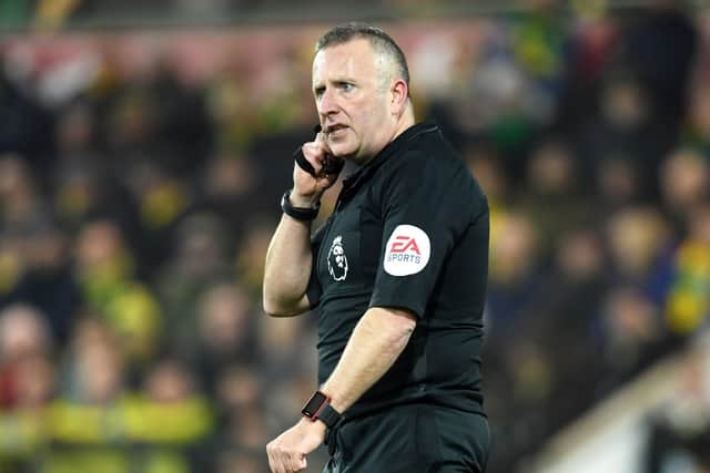 Referee Jon Moss: Ready for resumption.