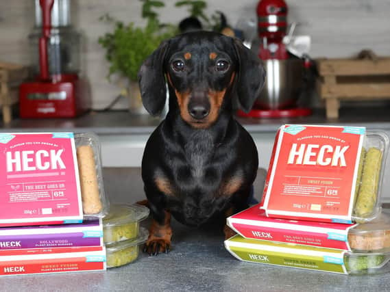Premium option: Miniature dachshund Honey with some of Hecks growing range of vegan products. Picture: Glen Minikin