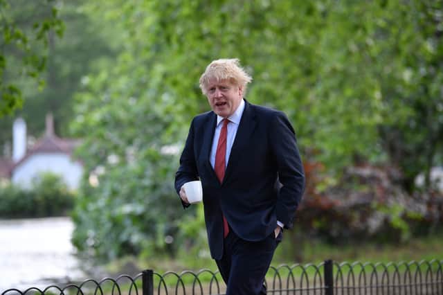 Prime Minister Boris Johnson takes a morning walk in St James's Park in London. Picture: PA Wire