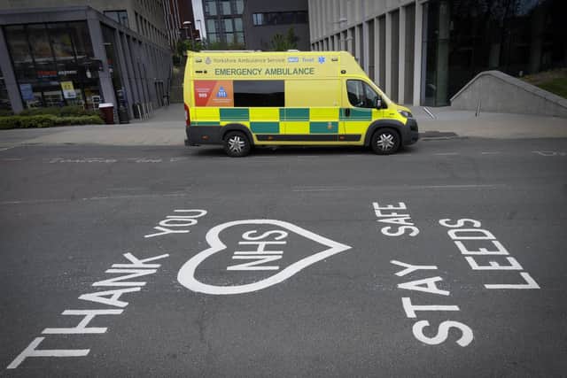 A new alert system is being established to monitor the threat posed by Covid-19. Pictured is a thank you message to the NHS in Leeds outside the LGI.