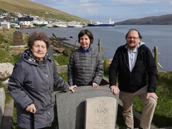 Tina Tausen and other Faroes islanders by the grave