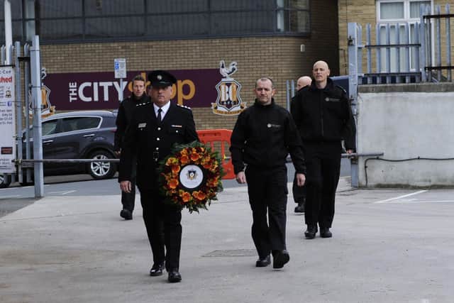 35th Anniversary of the Bradford City Fire Disaster, Valley Parade, Bradford. Members of the fire service lay a wreath at the memorial. Picture by Simon Hulme
