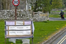 Signs made by local residents in Malham to deter visitors