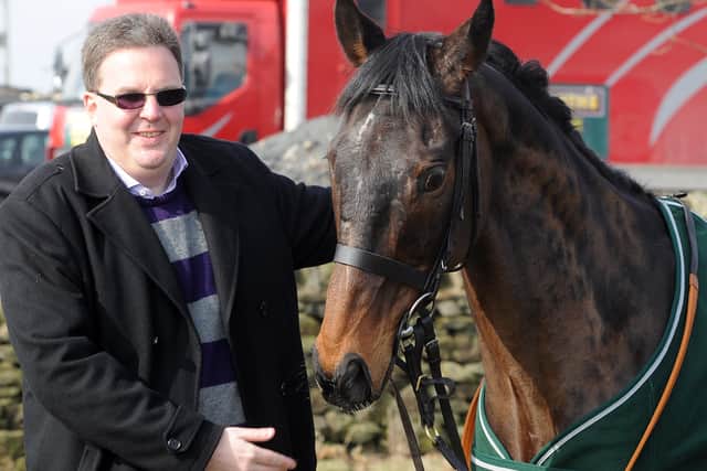 Racing correspondent Tom Richmond with Auroras Encore on the morning after the 2013 National. The horse is lasting the pace better than the reporter.