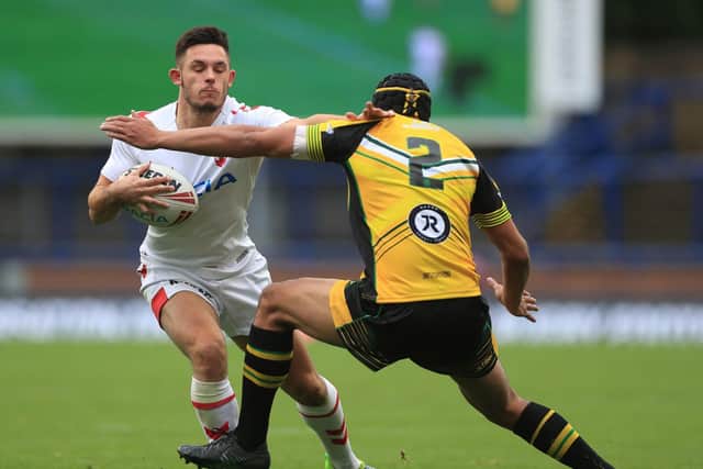 Niall Evalds takes on Ben Jones-Bishop, of Wakefield Trinity, as England Knights face Jamaica at Headingley. Picture by Mike Egerton/PA Wire.