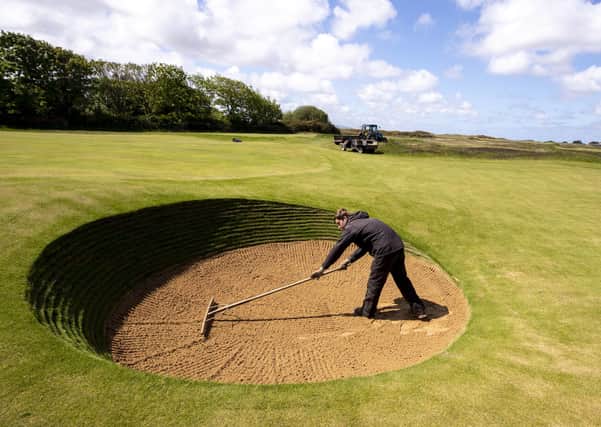 Ground staff tend to the Royal Liverpool golf course, Hoylake, Wirral to prepare it for play, ahead of the lifting of lockdown restrictions on some leisure activities.