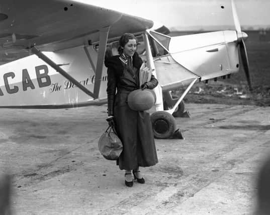 8th November 1932:  British aviation pioneer Amy Johnson (1903 - 1941) at Stag Lane aerodrome before leaving for Capetown in an attempt to break her husband's 17 hour record for the journey.  (Photo by Hudson/Topical Press Agency/Getty Images)