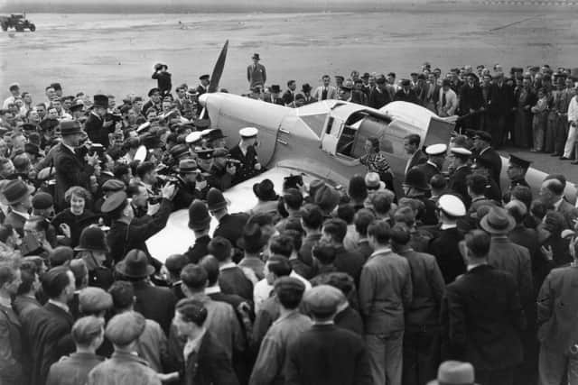 15th June 1936:  English aviator Amy Johnson arrives at Croydon, after setting a new record for a solo flight from Cape Town to London.  (Photo by Topical Press Agency/Getty Images)