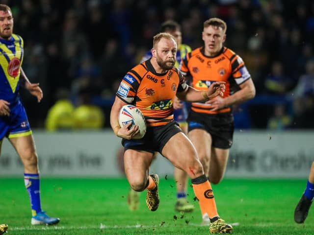 Castleford Tigers' Paul McShane in action against Warrington earlier this season with England rival Daryl Clark in pursuit. (Alex Whitehead/SWpix.com)