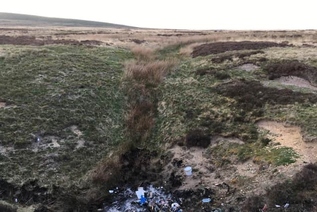 Images released by North Yorkshire Police of waste tipped in a sinkhole on land in rural Richmondshire then set on fire