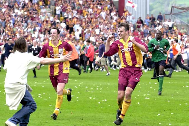 Bradford goalscorer David Wetherall (right) runs off alongside team mate Andy O'Brien after beating Liverpool to keep the club in the Premier League. Picture: John Giles/PA Wire