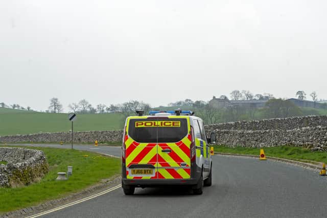 What are the new coronavirus laws and how does it affect me? Pictured: A police van in Malham, North Yorkshire, before the new movement laws.