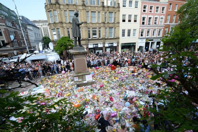 Floral tributes in St Ann's Square, Manchester, following the Arena bombing in 2017. Photo: Ben Birchall/PA