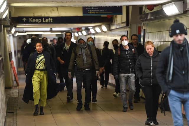 Passengers wear face masks in the underpass at Clapham Junction station in London. Picture: Kirsty O'Connor/PA Wire