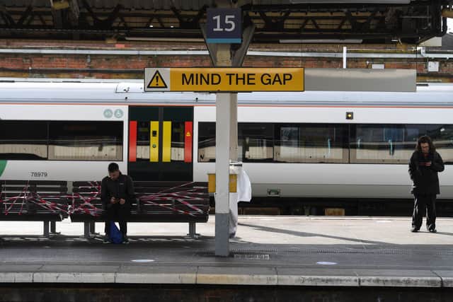 Passengers wait to board a train at Clapham Junction Station in London, after the announcement of plans to bring the country out of lockdown. Picture: Kirsty O'Connor/PA Wire