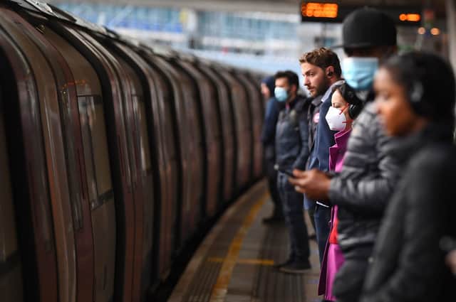 Passengers wear face masks and stand apart on a platform at Canning Town underground station in London, after the announcement of plans to bring the country out of lockdown. Picture: Victoria Jones/PA Wire