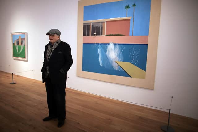 NOTTINGHAM, ENGLAND - NOVEMBER 30:  Artist David Hockney stands by 'A bigger splash 1967' one of his works on display at the new Nottingham Contemporary art space which is holding a major retrospective of his work on November 30, 2009 in Nottingham, England. The recently opened 19 GBP million building, by architects Caruso St John, is showing over 60 works by David Hockney.  (Photo by Christopher Furlong/Getty Images)