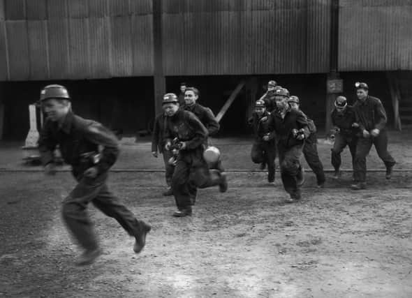 A group of Bevin Boys - young men conscripted to work in British coal mines during World War II, set off on a cross-country run in full pit-gear during a fitness exercise at Chisley Colliery in Kent, 16th February 1944. (Photo by Keystone/Hulton Archive/Getty Images)